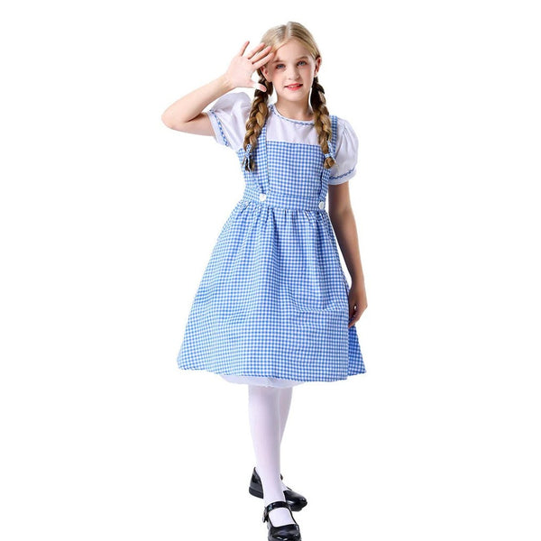 Girl in Dorothy costume shading her eyes in a storybook farm-girl pose