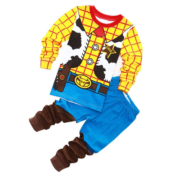 Woody kids pyjama set flat lay, cowboy print top and blue pants