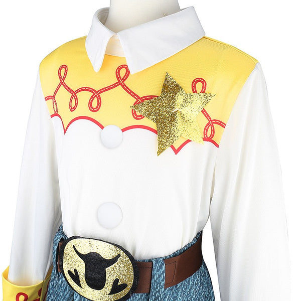 Jessie costume close-up - yellow yoke, red loop embroidery, gold star and belt buckle - Lets Party