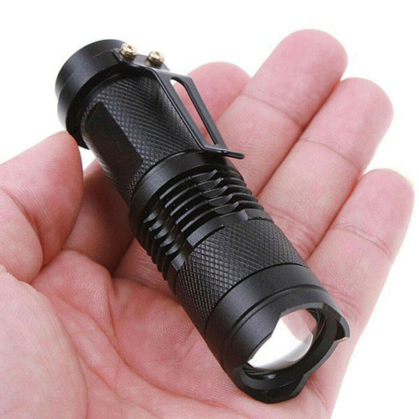 UV inspection light shown at pocket size next to a hand for scale