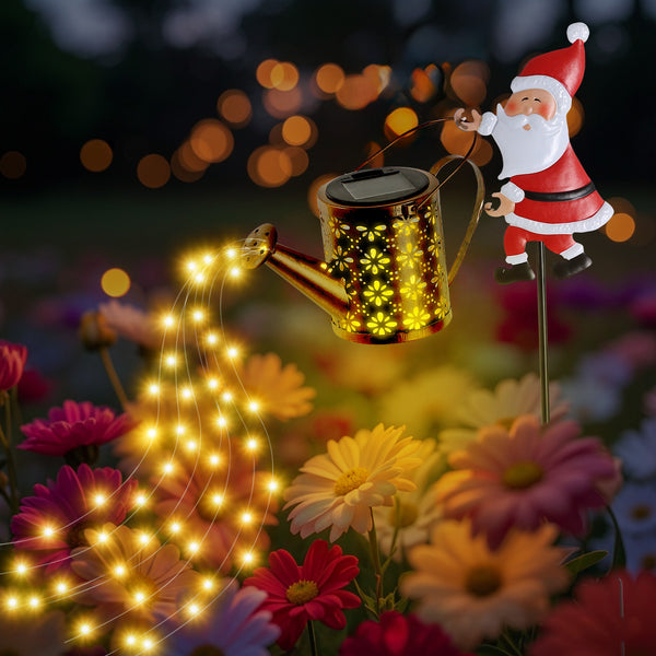 Solar Santa watering can stake light with a string light cascade from the spout