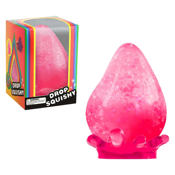 Pink glitter teardrop squishy beside its box