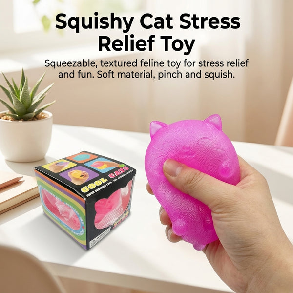 Hand squeezing the pink squishy cat stress toy on a desk