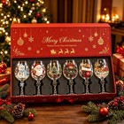 Six decorated Christmas wine glasses displayed in a gift box