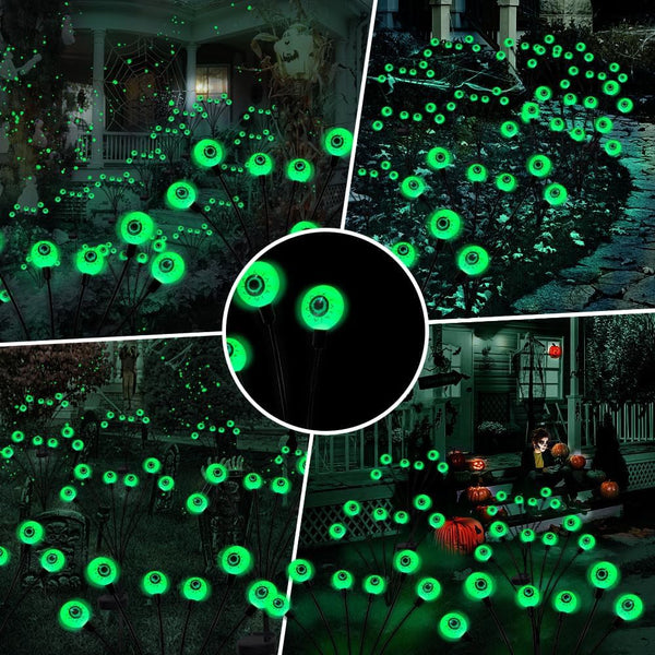 Halloween pathway lights glowing beside a front door