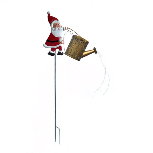 Solar Santa watering can Christmas light on a plain background