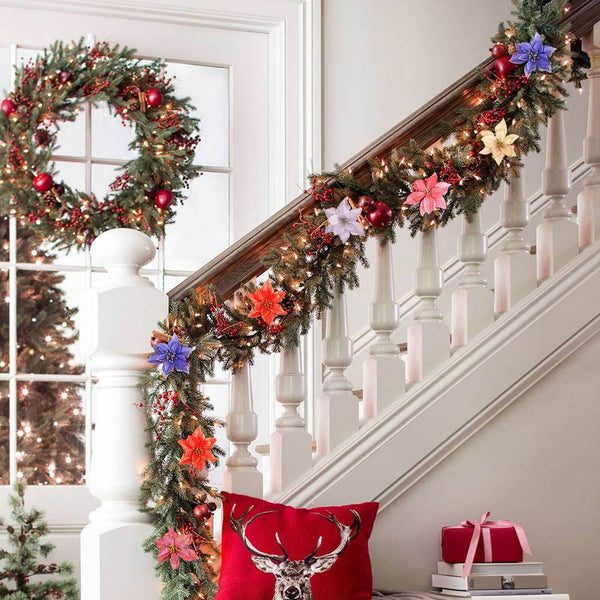 Poinsettia flowers in a Christmas garland on a staircase