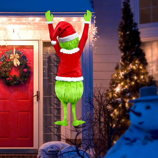 Green grump climbing decoration on the front of a house at night