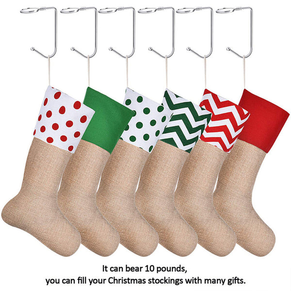 Six stocking holders on a mantel holding hessian Christmas stockings