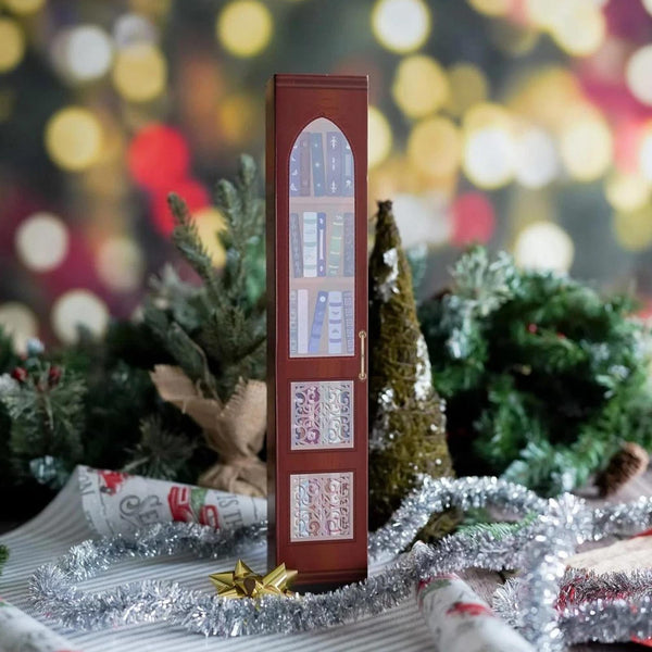 Red book advent calendar closed with Christmas decorations