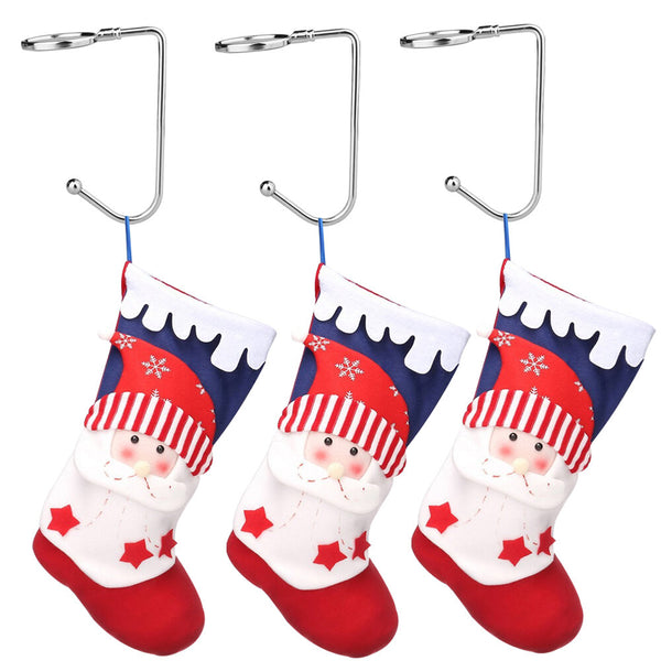 Three stocking hooks holding red and white Christmas stockings