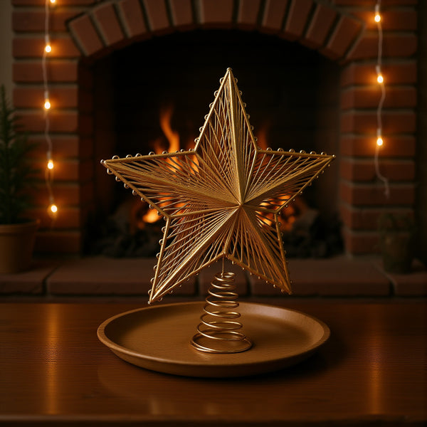 Layered gold star topper in front of a fireplace