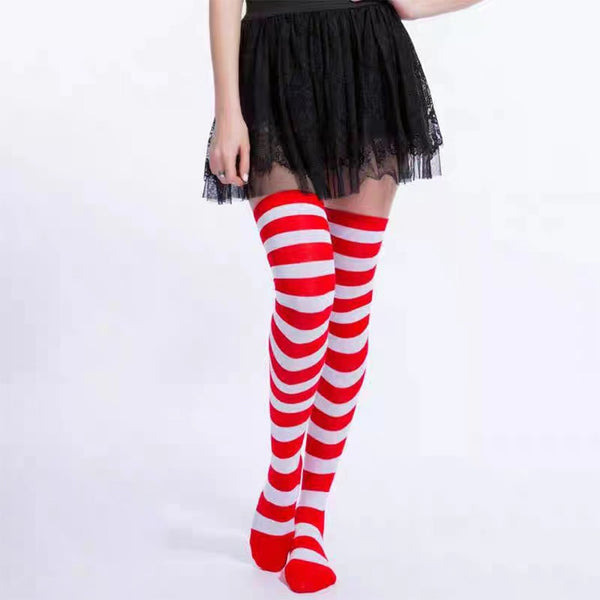 Red and white striped over-knee socks worn with a skirt