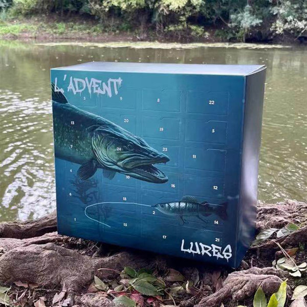 Fishing lure advent calendar box sitting on a riverbank