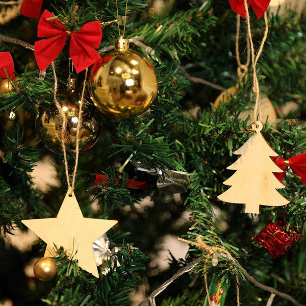 Wooden star and tree ornaments with twine on a Christmas tree
