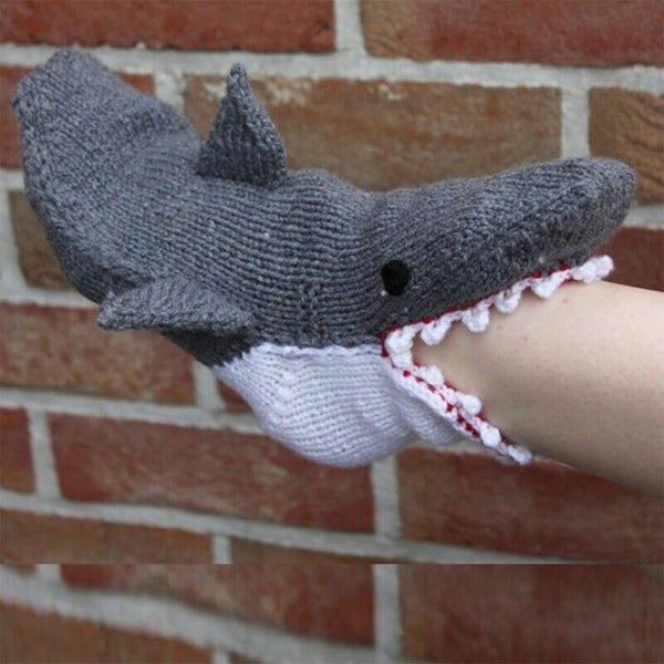 Shark socks against a brick wall