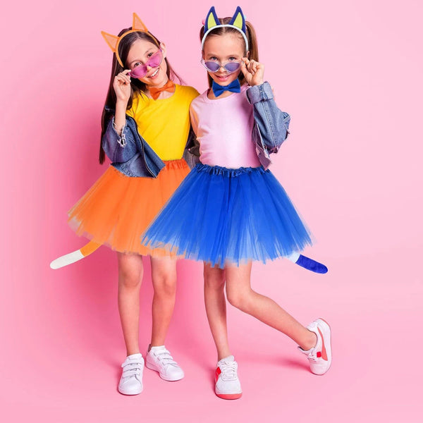 Two kids wearing Bluey and Bingo tutu costumes