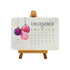 December 2027 seed paper desk calendar card with bauble illustration on its stand