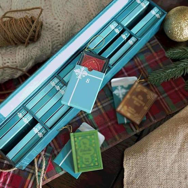 Blue book advent calendar lying flat with mini books and boxes