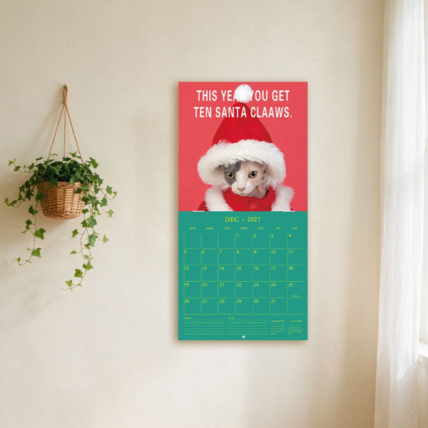 Funny cat wall calendar December 2027 page with a cat in a Santa hat