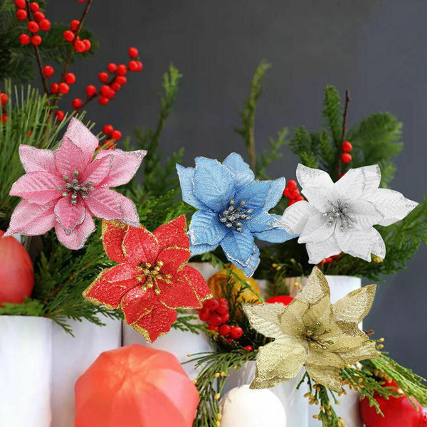 Mixed colour poinsettia flowers in a Christmas table arrangement