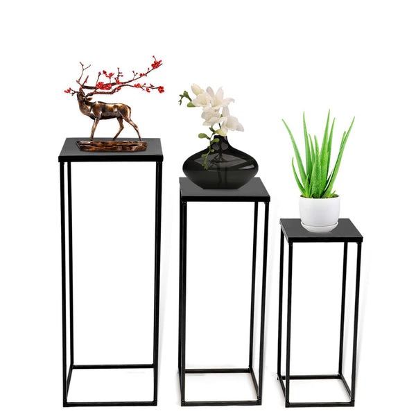 Geometric metal stand holding a floral arrangement