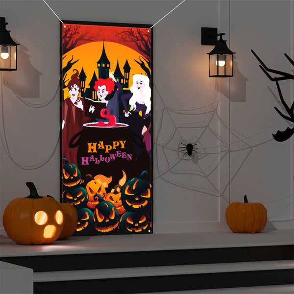 Halloween door cover hanging from adhesive hooks on a door frame