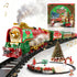 Christmas train set with smoking steam-style locomotive, carriages, track and tree decorations