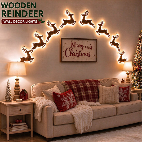 Light up Christmas wall decorations - wooden LED reindeer glowing in an arch above a sofa