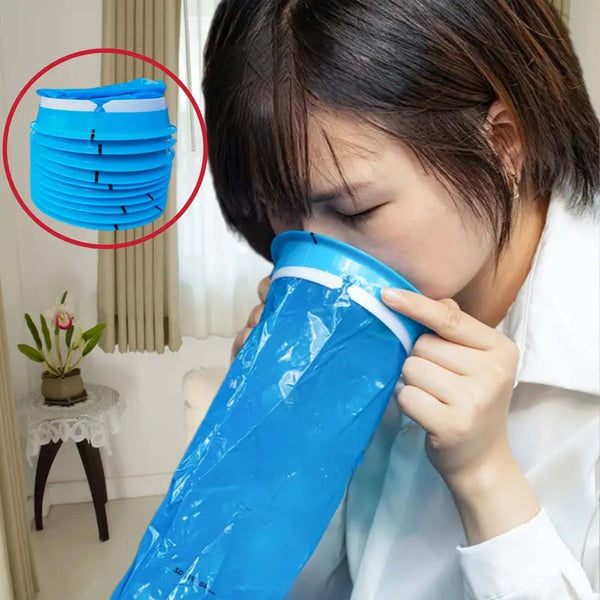 Woman using a disposable sick bag at home