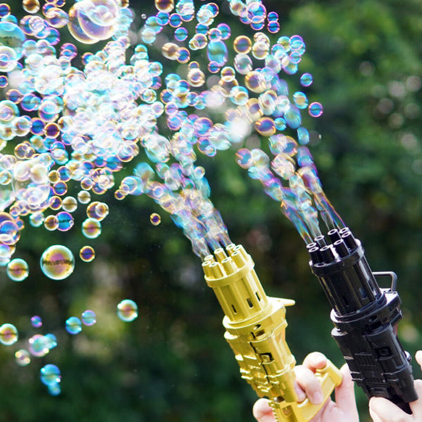 Gold and black bubble guns blowing bubbles in a garden