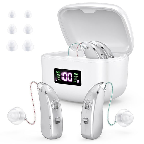 Senior man wearing behind-the-ear hearing aid with silver units and charging case - Lets Party