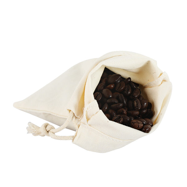 Calico bag holding coffee beans