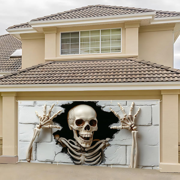 Halloween wall backdrop hung across a garage door outdoors