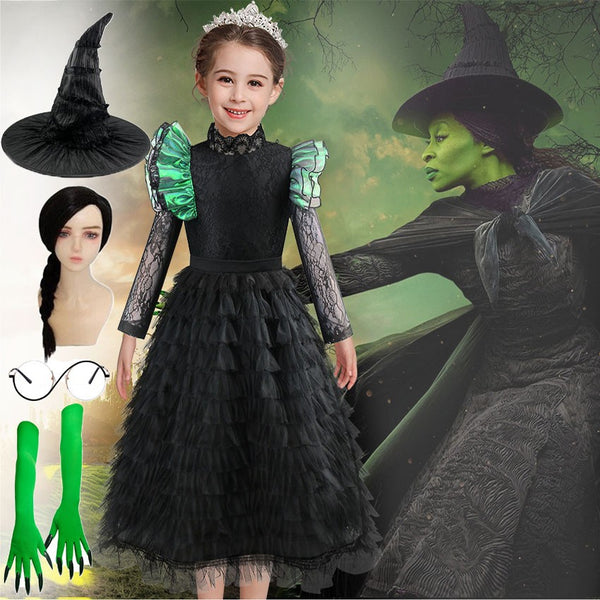 Girl wearing Wicked Elphaba costume - black ruffle witch dress with green sleeves, hat and green gloves - Lets Party