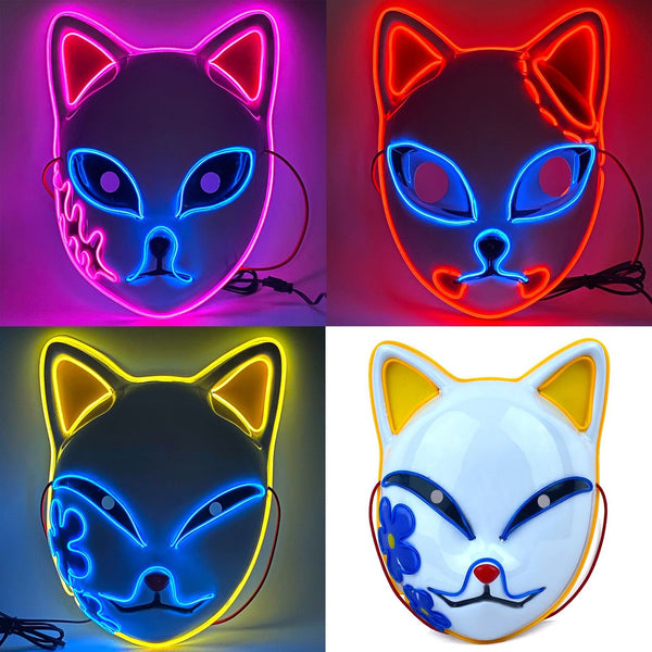 Kitsune masks glowing in pink, red and yellow beside a plain white fox mask