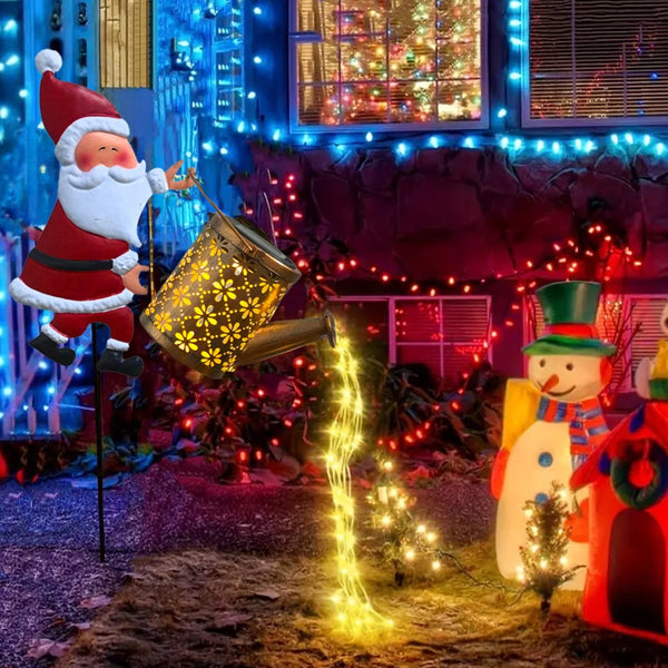 Santa watering can solar light with LED string lights pouring from the spout