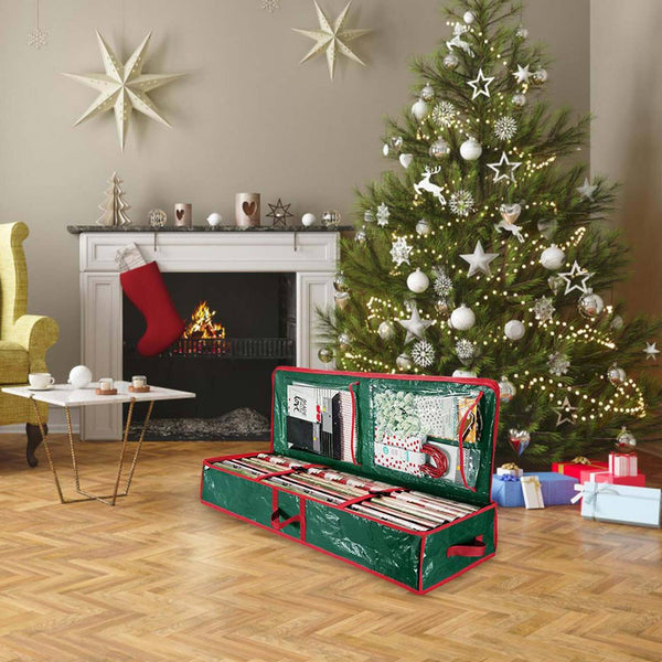 Green wrapping paper organiser on a living room floor at Christmas