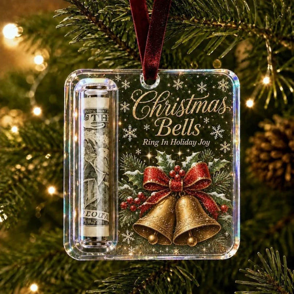 Bells cash holder ornament with a rolled note hanging on a Christmas tree