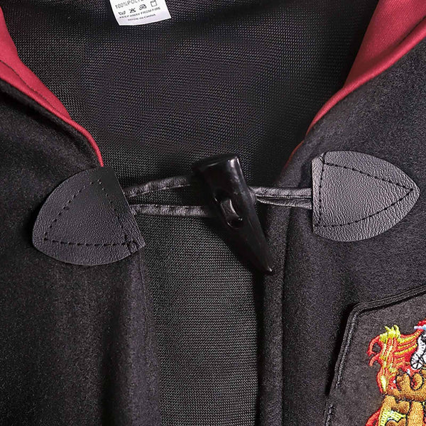 Close-up of the robe toggle fastening and red hood lining