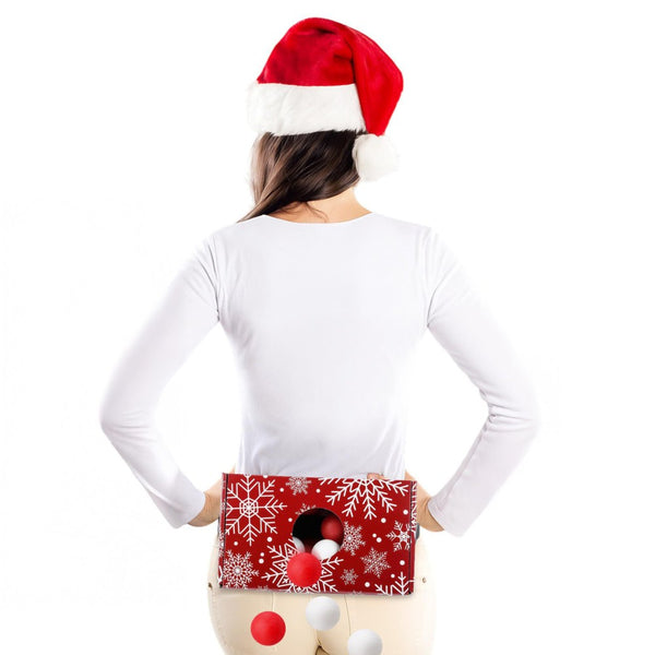 Christmas party game: woman in a Santa hat shaking balls out of a snowflake box strapped to her waist