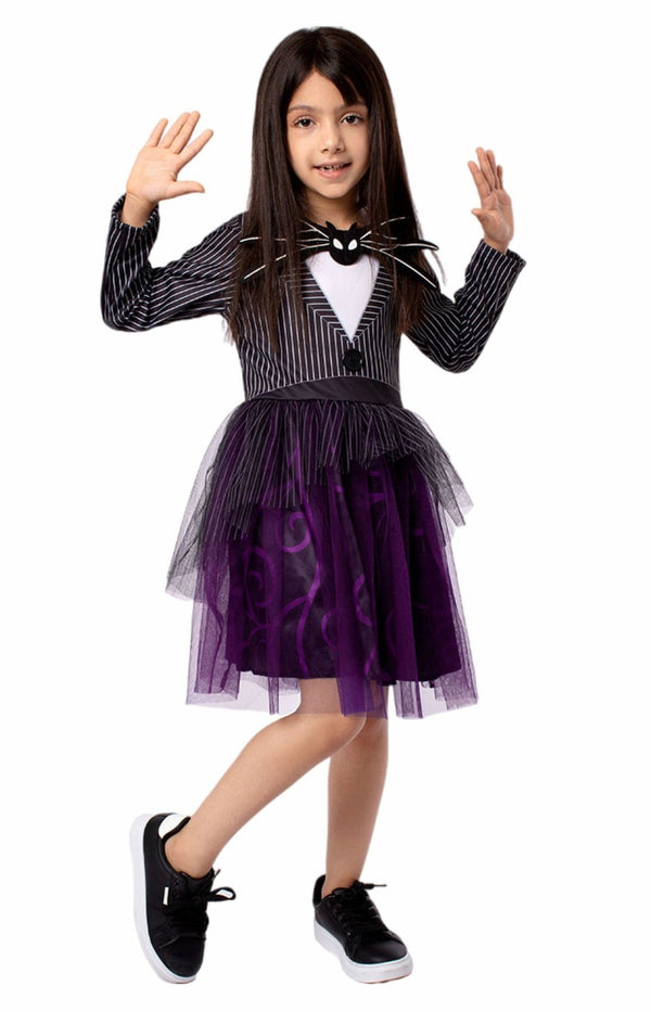 Girl waving in a gothic skeleton dress with bat bow