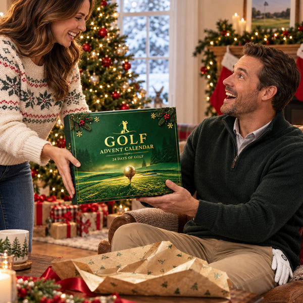 Man opening a green golf advent calendar, a Christmas gift for golfers, beside the tree