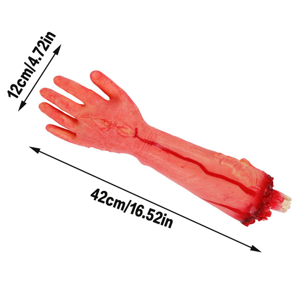 Fake body part props arranged for a haunted house scene