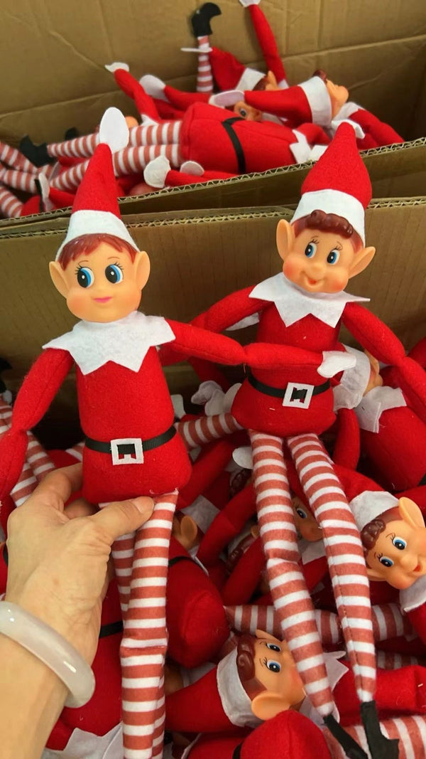 Red Christmas elf dolls packed in the carton
