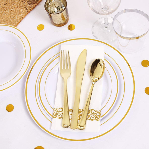 Gold plastic plate setting with cutlery and napkin