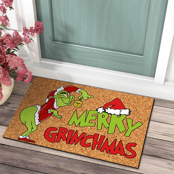 Merry Christmas green grump doormat on a porch