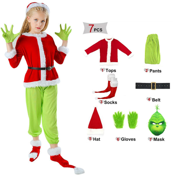 Girl in the green Christmas costume beside the 7 piece set