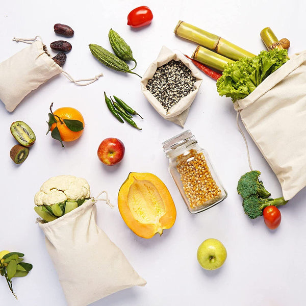 Calico bags holding fruit, vegetables and grains