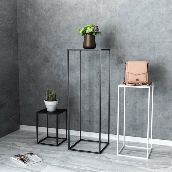 Geometric metal stand set arranged as a tiered display